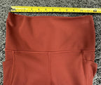 Athleta salutation Stash Pocket II Twist 7/8 Leggings Powervita Rust Red XS