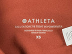 Athleta salutation Stash Pocket II Twist 7/8 Leggings Powervita Rust Red XS