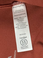 Athleta salutation Stash Pocket II Twist 7/8 Leggings Powervita Rust Red XS