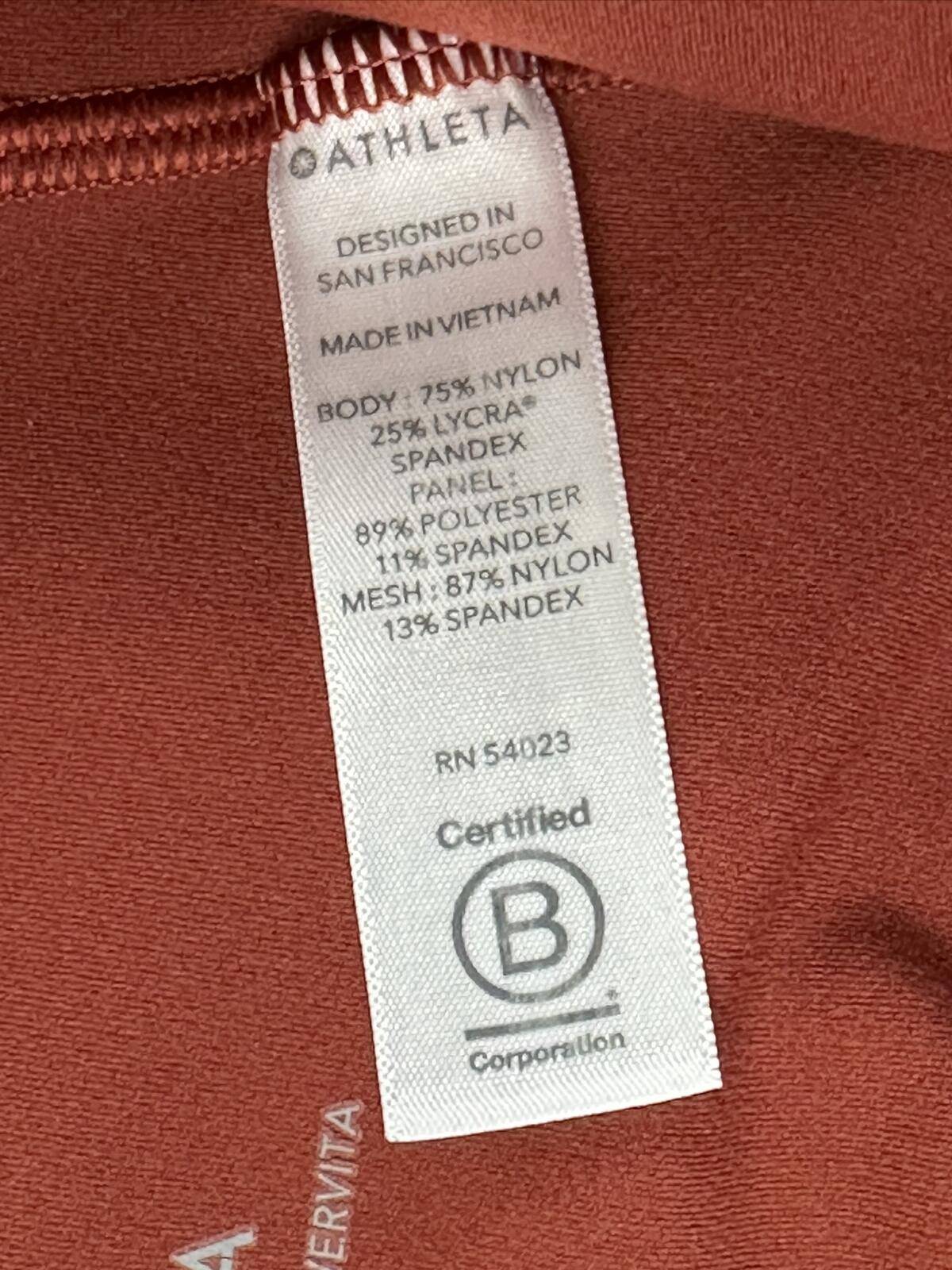 Athleta salutation Stash Pocket II Twist 7/8 Leggings Powervita Rust Red XS