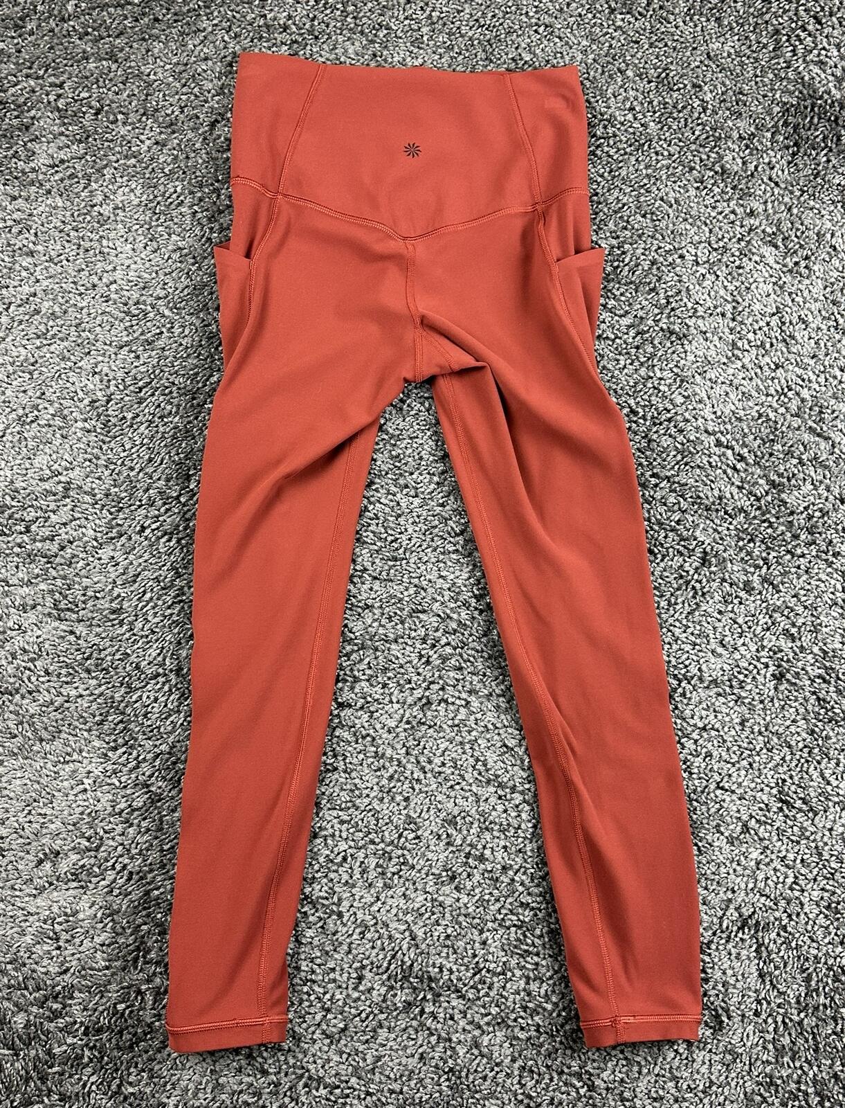 Athleta salutation Stash Pocket II Twist 7/8 Leggings Powervita Rust Red XS