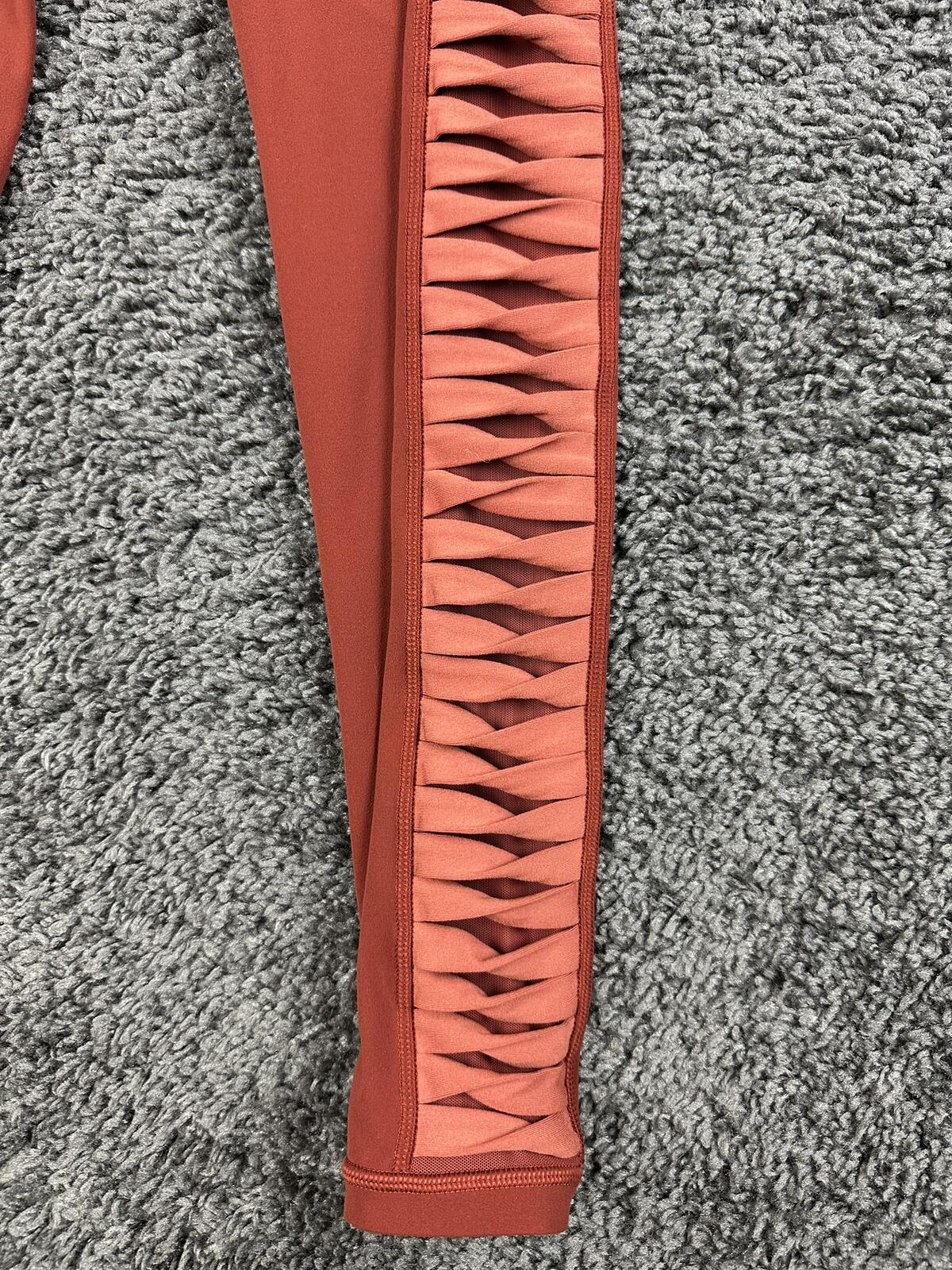 Athleta salutation Stash Pocket II Twist 7/8 Leggings Powervita Rust Red XS
