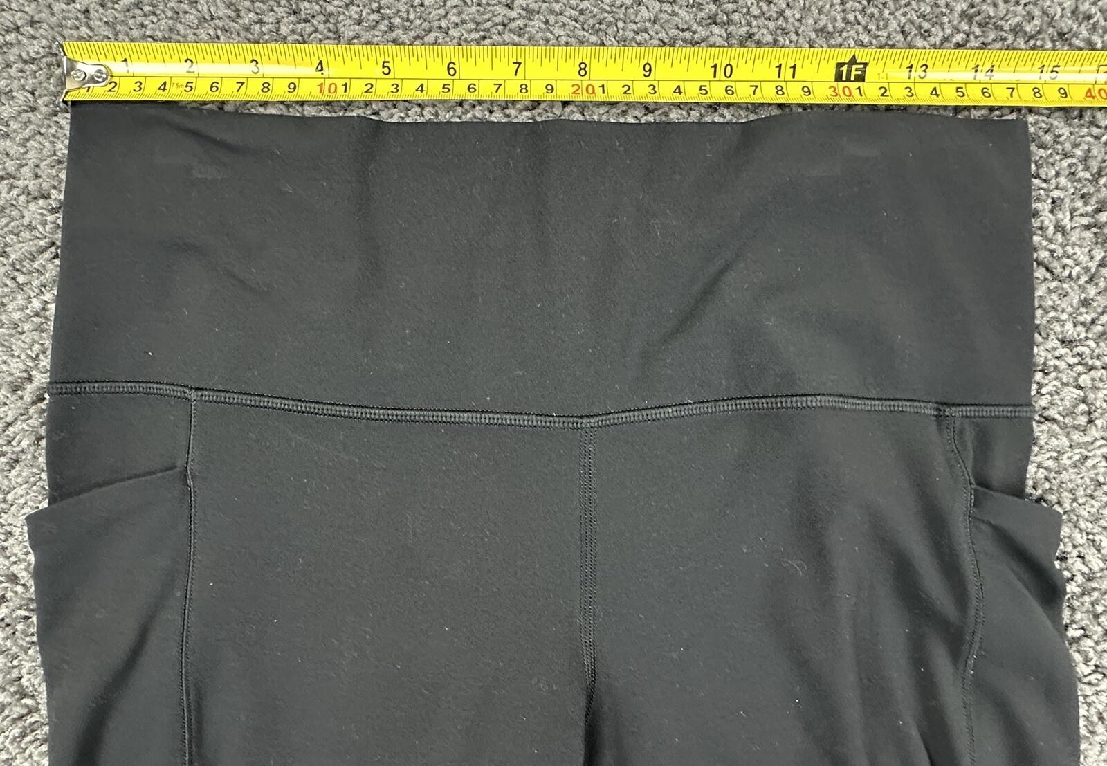 Athleta Salutation Stash 7/8 Tight Leggings Black Pockets Yoga Pants Size Large