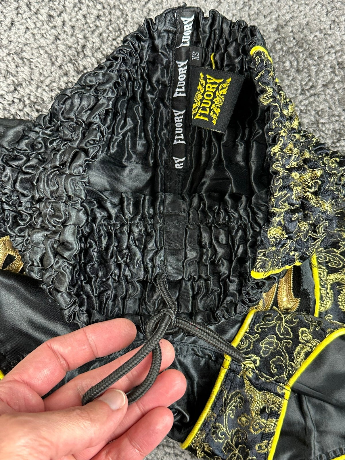 FLUORY Mens XS Black Muay Thai Shorts Gold Brocade Dragon Thai Script Boxing