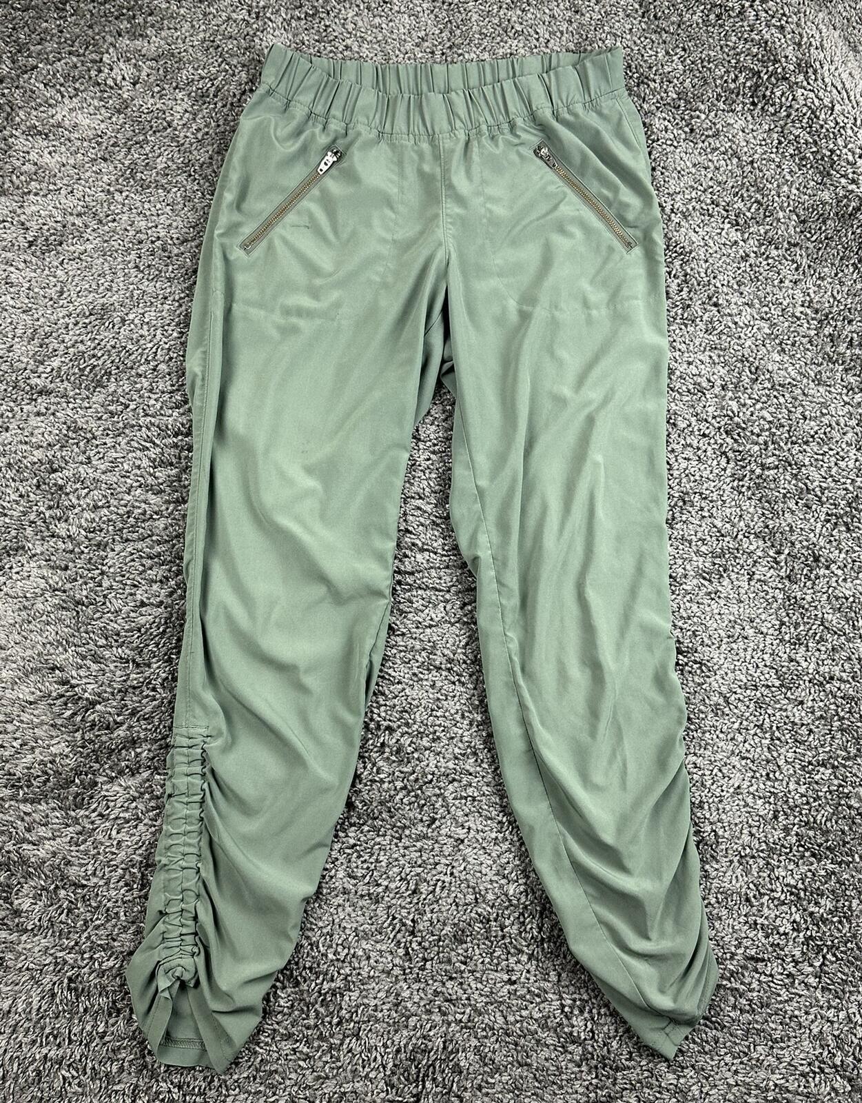 Athleta Aspire Ankle Green Ruched Stretch Jogger Pant Zip Pockets Womens Size 4